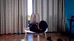 Curvy brunette maid strips in pantyhose at dorm table