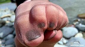 Goddess in Tan Nylons Teases with Cute Soles by Riverside