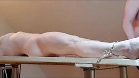 In this homemade scene, a milf slave is tied to the desk, humiliated with candles, and forced to masturbate