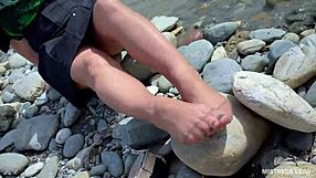 Goddess in Tan Nylons Teases with Cute Soles by Riverside