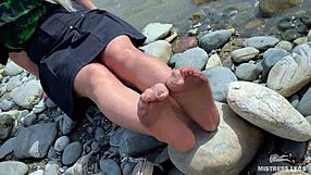 Goddess in Tan Nylons Teases with Cute Soles by Riverside