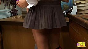 three lesbian friends in uniforms have fun on the desk