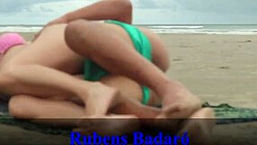 African couple sneaks away from beachgoers to bang on sandy shore. Full video awaits on Red.
