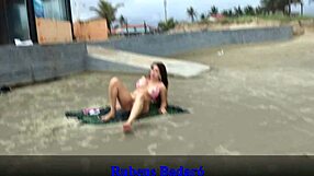 African couple sneaks away from beachgoers to bang on sandy shore. Full video awaits on Red.