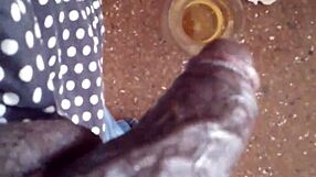 The milf's shaved pussy glistens under the salty rain.