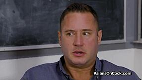 Asian teen spinner rides in classroom by chalkboard