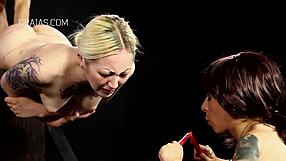 girls get whipped and held over candles in intense bdsm session