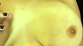 brunette with huge natural tits kissing at party