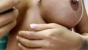 Monika Fox strips naked at home, rubbing cream over her big fake tits and curvy butt in solo tease