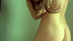 Beautiful brunette milf strips panties to reveal big tits, juicy ass, and wet pussy for teasing show.