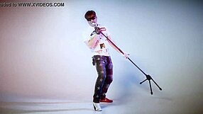 Alex Angel performs lesbian song with kissing