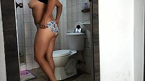 the boss's stepdaughter feels excited recording herself undressing her huge natural tits in the bathroom