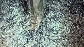 She explores her hairy ebony pussy in wet solo masturbation at home