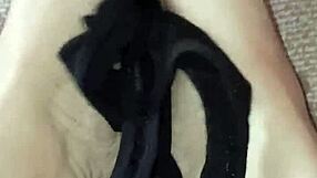 Gretala suggestively rubs her thong on her bare feet.