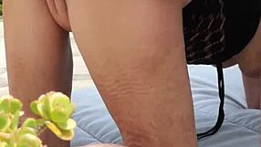 Mature amateurs passionately making love in the garden.