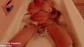 Kity Hudson Enjoys Bath Tub Time With Her Curvy Ass And Trimmed Pussy