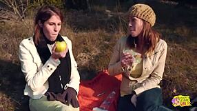 A couple of tattooed brunettes enjoy wild strapon sex on an outdoor hike