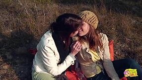 A couple of tattooed brunettes enjoy wild strapon sex on an outdoor hike