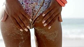 Is that beach hottie in bikini teasing her ass?