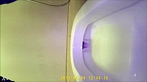 Asian teen sneaks into the toilet for a quick pee break, hidden camera catches every moment.