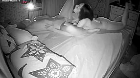 a hot lesbian couple shares intimate moments in the dark, kissing and fingering each other to orgasm