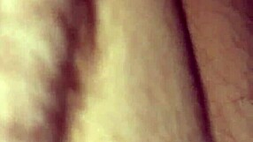 Masked figure bound tightly while performing deep blowjob on hard cock.