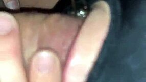 Masked figure bound tightly while performing deep blowjob on hard cock.