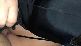 Masked figure bound tightly while performing deep blowjob on hard cock.