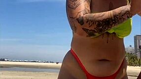 Wow, married babe draws eyes on the beach flashing in her tiny bikini!