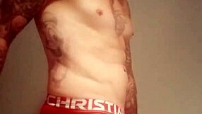 He pulls out his massive tattooed cock for a solo homemade masturbation session.