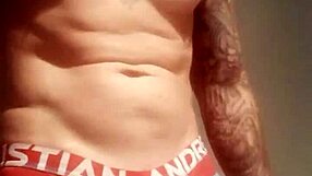 He pulls out his massive tattooed cock for a solo homemade masturbation session.