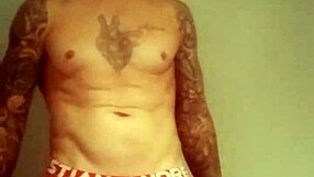 He pulls out his massive tattooed cock for a solo homemade masturbation session.