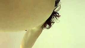 pretty curvy milf with big tits and tattoo poses solo on camera