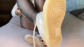 hey, check out this black nylon feet fetish with nike air force tights on that girl