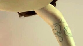 pretty curvy milf with big tits and tattoo poses solo on camera