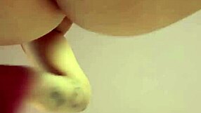 pretty curvy milf with big tits and tattoo poses solo on camera