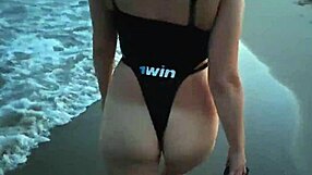 blonde shows tits and sucks cock on a public beach with brunette watching