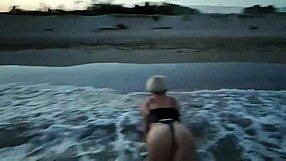 blonde shows tits and sucks cock on a public beach with brunette watching