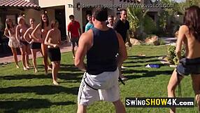 Group of horny swingers strips naked in summer reality setting for wild orgies and group sex.