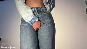The cute girl next door desperately pees her jeans in a homemade solo moment.