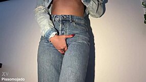 The cute girl next door desperately pees her jeans in a homemade solo moment.