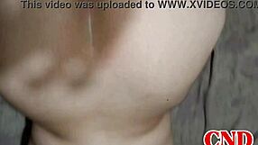 In the dorm, the Brazilian girlfriend bends over on the bed as the husband watches her scream during intense action