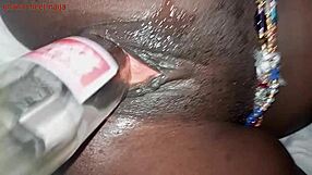 ebony babe fists her ass then fucks pussy deep with coca cola bottle