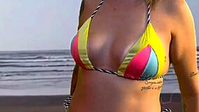 beach girl grabs waiter's hard cock bulge to feel