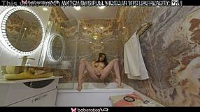 Does this wet brunette's long hair sway while fingering pussy in bathroom?