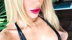 Wetlook suit clings tight as leather boots tease hidden curves in sultry display.