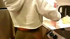 Hey, watch her grind and shake that ass perreando right in the kitchen