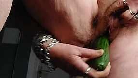granny shoves cucumber deep in hairy wet pussy!