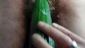 granny shoves cucumber deep in hairy wet pussy!