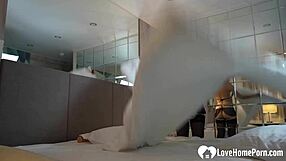 Redhead babe slips into black lingerie posing teasingly then masturbates solo